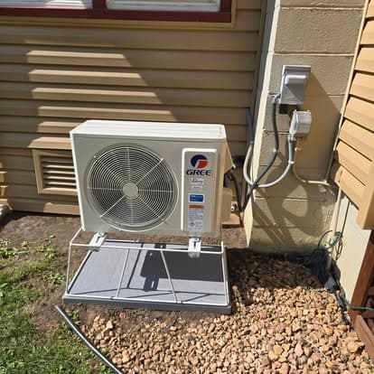 Ductless mini-split outdoor condenser unit installed at a residential property